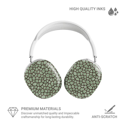 Mossy Mosaic AirPods Max Covers with sage green giraffe spots outlined in chocolate brown from the Wild Atelier collection.