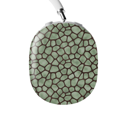 Mossy Mosaic AirPods Max Covers with sage green giraffe spots outlined in chocolate brown from the Wild Atelier collection.