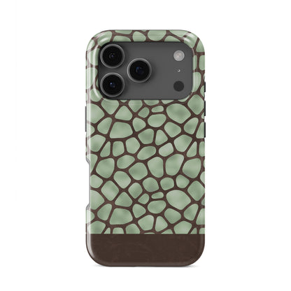 Mossy Mosaic Tough Phone Case with sage green giraffe spots outlined in chocolate brown from the Wild Atelier collection.
