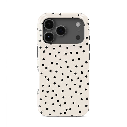Cream tough phone case with scattered black dot pattern and minimal polka dot design