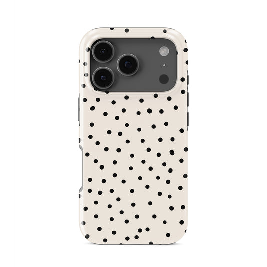 Cream tough phone case with scattered black dot pattern and minimal polka dot design