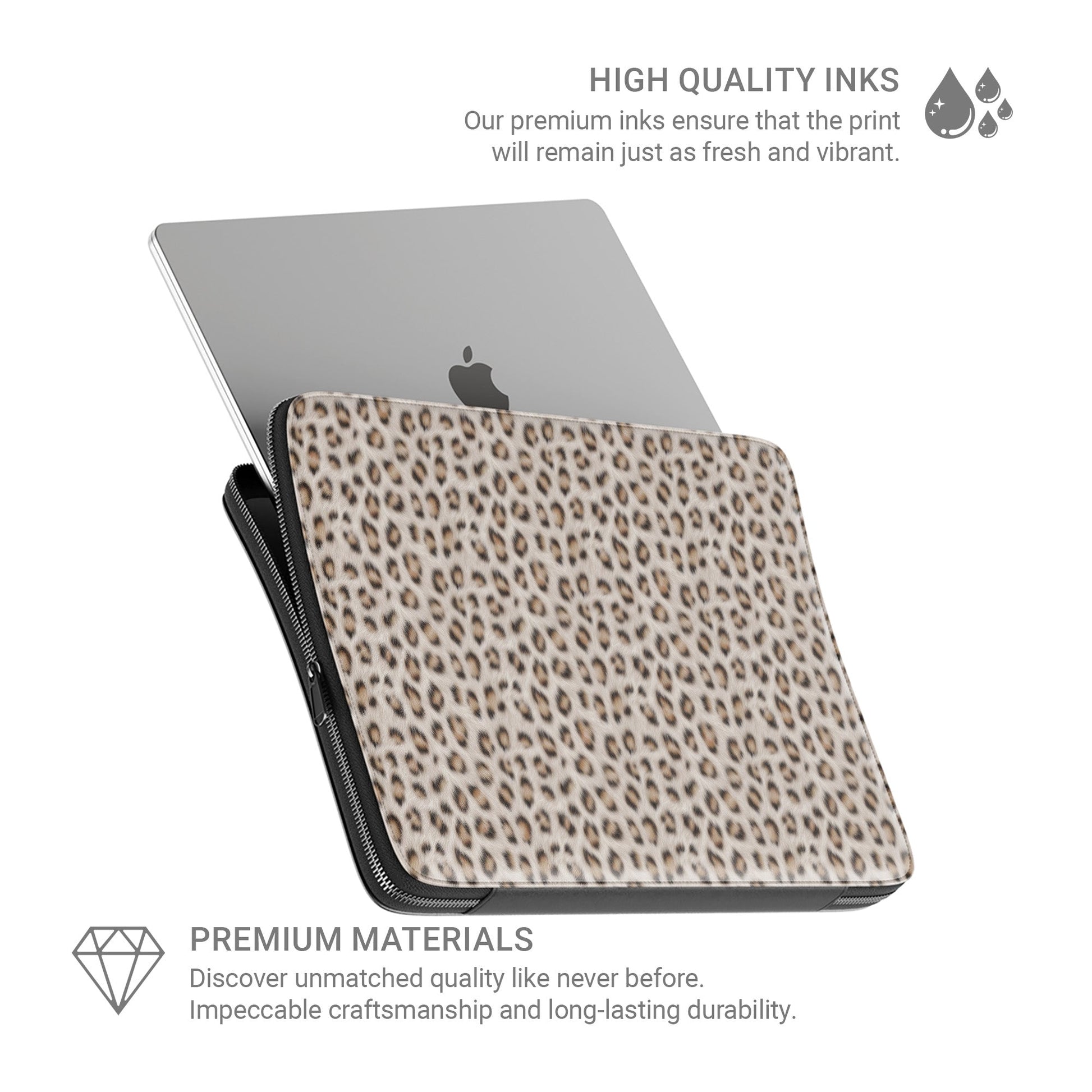 Snowy Roar laptop sleeve with soft snow-leopard print, vegan leather exterior, padded interior and smooth metal zipper.