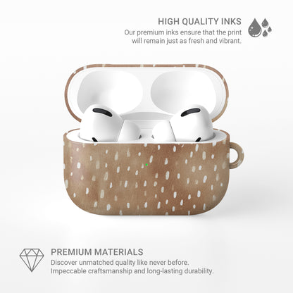 Fawn Fleck AirPods case in warm beige with irregular tan speckles and organic abstract marks.