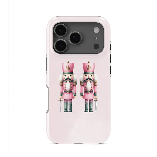 Glossy tough phone case with two pink Nutcracker soldiers on a blush background, dual layer style, Case & Charm Sugarplum Soldiers design