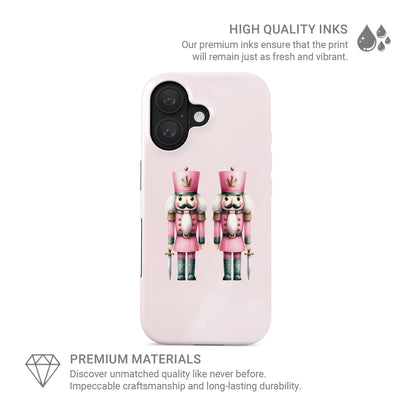 Glossy tough phone case with two pink Nutcracker soldiers on a blush background, dual layer style, Case & Charm Sugarplum Soldiers design