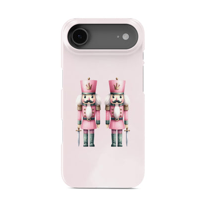 Two pink Nutcracker soldiers on a pink background, pastel Christmas artwork On a protective snap phone case. Case & Charm tech accessories